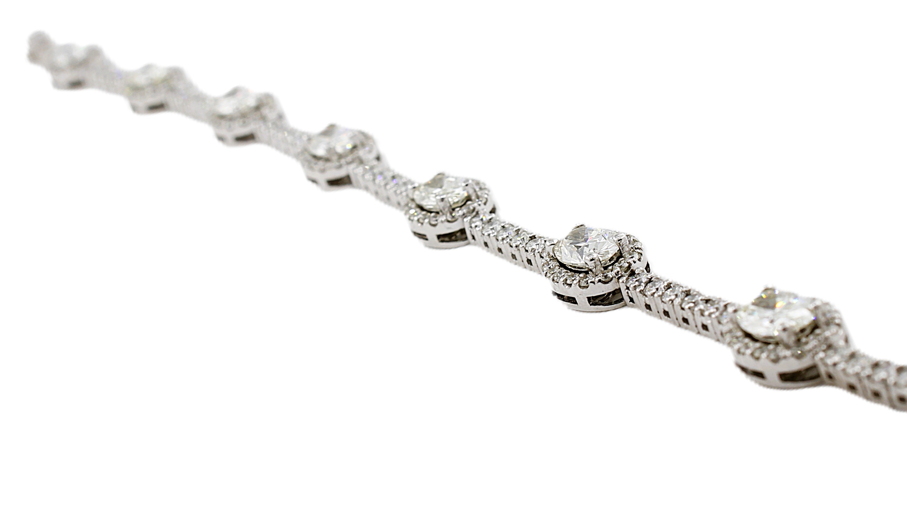Round & Oval Cut Diamond Tennis Bracelet with Halo's